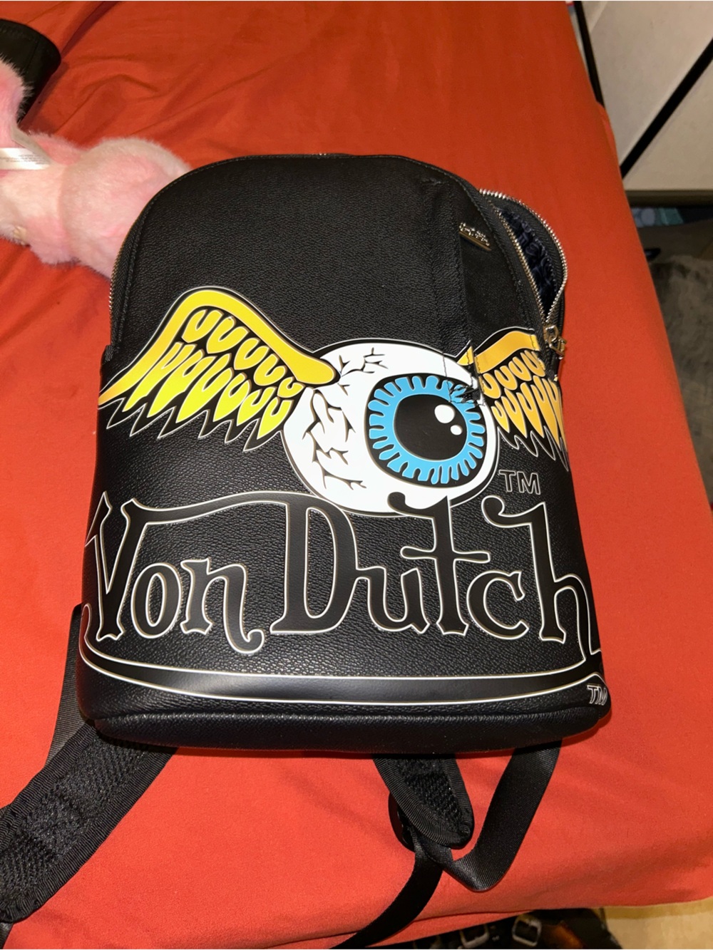 Von Dutch Black Crossbody Bag with Yellow Wings and Blue Eyeball Graphic